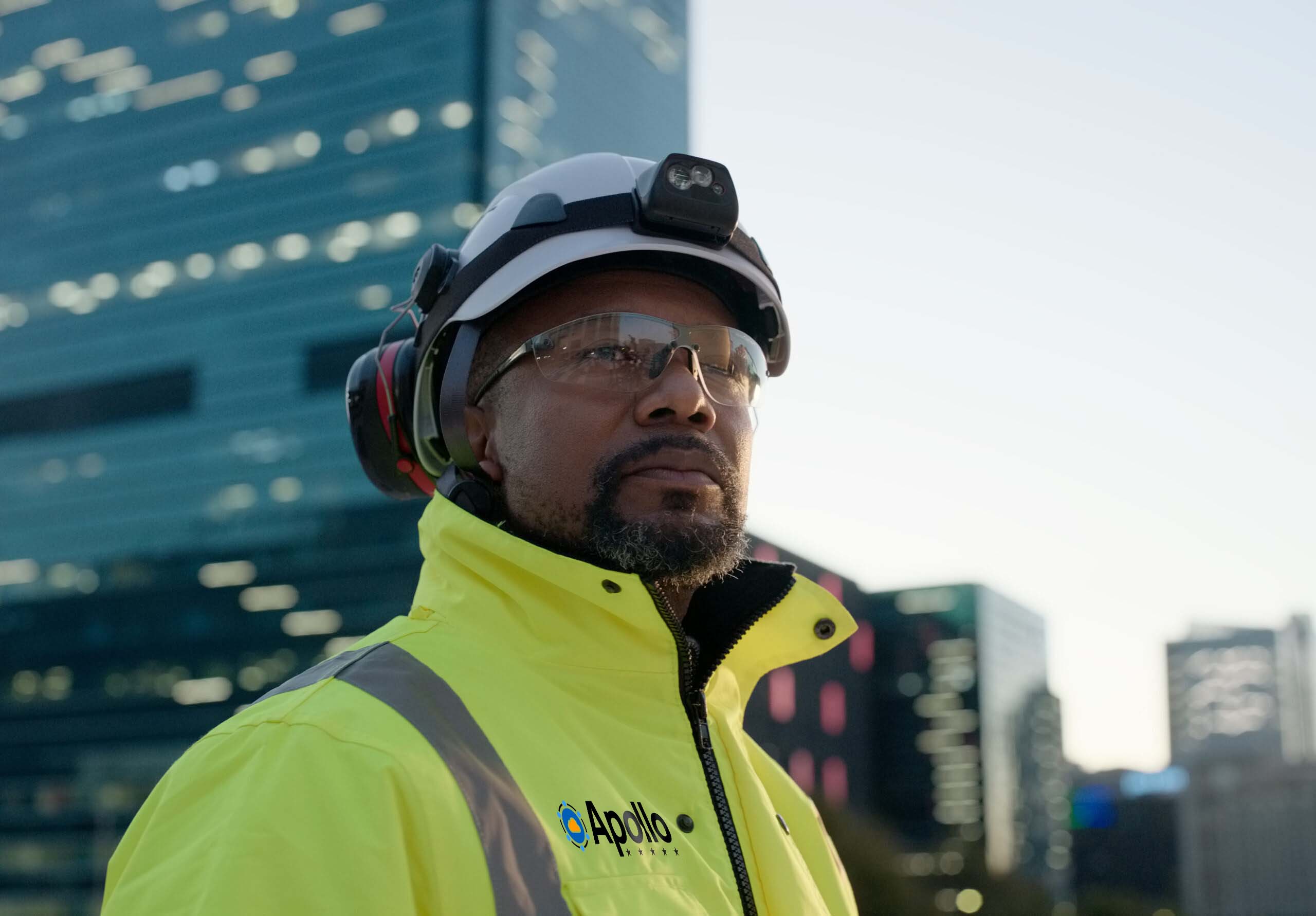 Mission critical engineer at job site in downtown New York, wearing PPE.