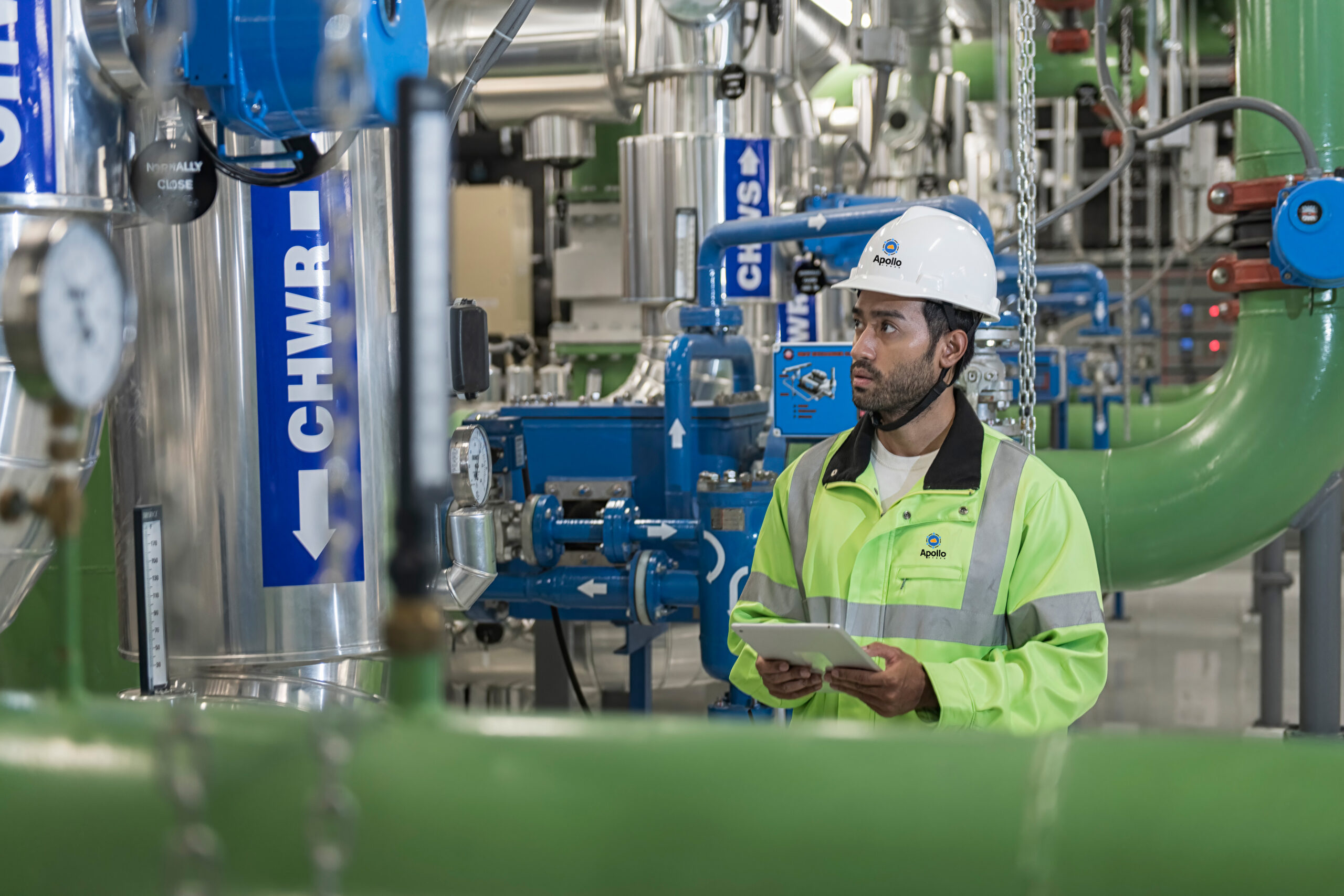 Male engineer working in data center. 