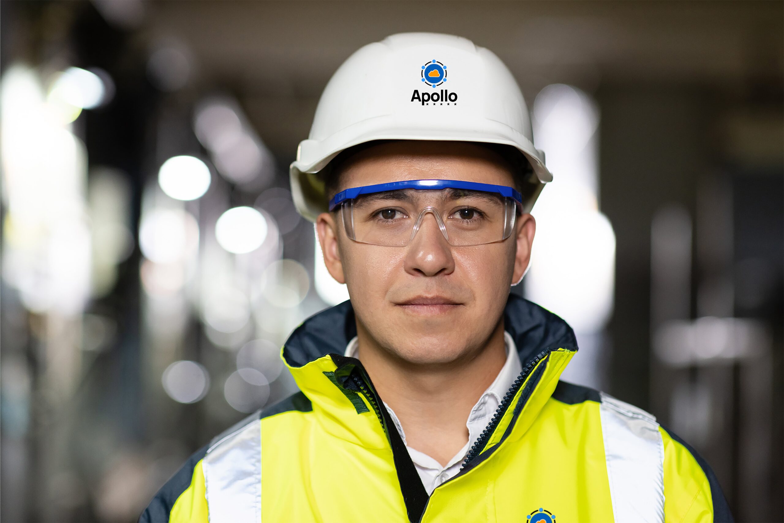 Mission critical engineer wearing PPE with the Apollo MCE logo on his hard hat.